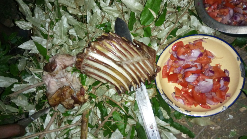 Dinner is ready Crispy goat ribs with a very delicious tomato-onion salad called "Kachumbari" - the perfect barbecue.